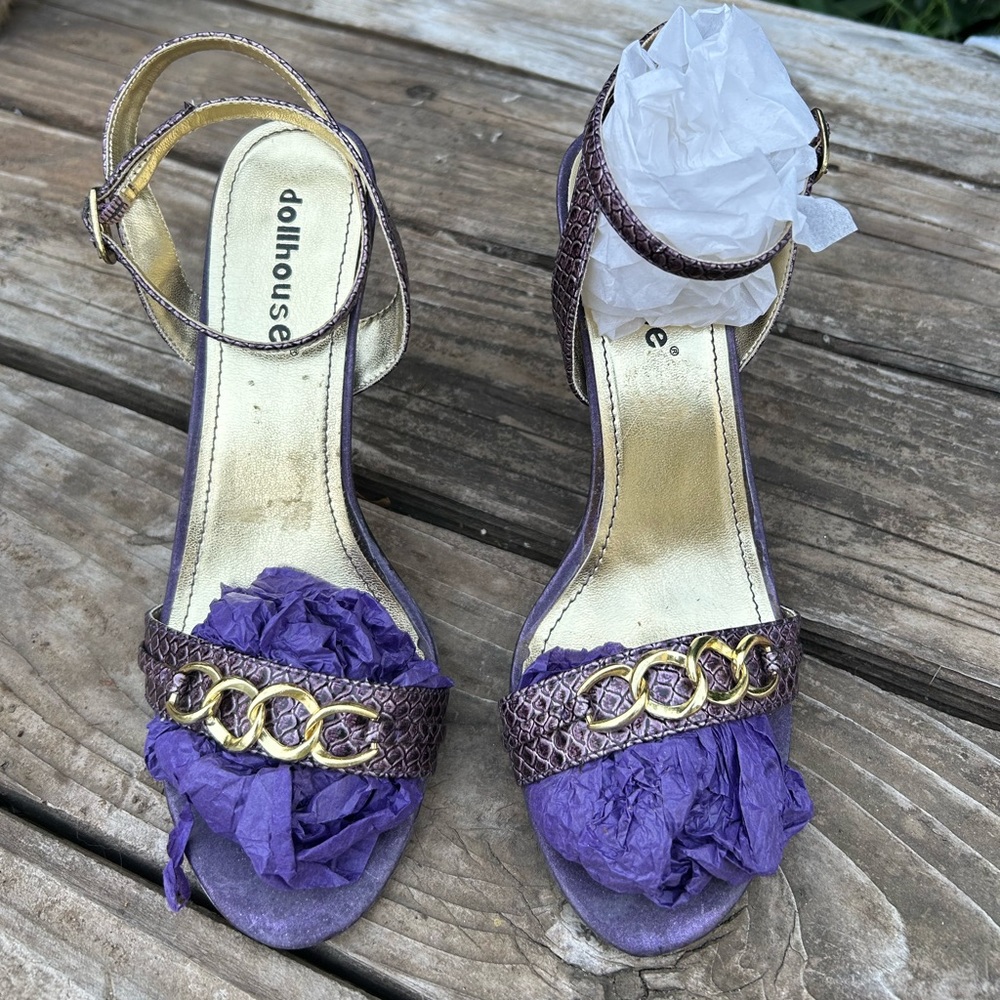 Purple “snake skin” stiletto sandals with gold chain trim.
